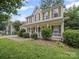 Two-story home with a charming front porch and lush green lawn, perfect for suburban living at 14520 Cardamon Ct, Charlotte, NC 28273