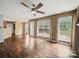 Expansive living room featuring hardwood floors, a ceiling fan and generous natural light at 14520 Cardamon Ct, Charlotte, NC 28273