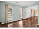 Open living room showcasing hardwood floors and large windows, filling the space with natural light at 14520 Cardamon Ct, Charlotte, NC 28273