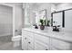 Modern bathroom with dual sinks, white cabinets, and sleek fixtures at 1474 Samuel St, Charlotte, NC 28206