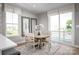Charming dining area with modern table and chairs near a sliding glass door at 1474 Samuel St, Charlotte, NC 28206
