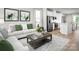 Inviting living room featuring a comfortable sofa, stylish decor, and plenty of natural light at 1474 Samuel St, Charlotte, NC 28206