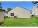 Home's backyard shows green grass, the back of the house, and a chain-link fence at 1628 Sandpiper Dr, Rock Hill, SC 29732
