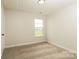 Cozy bedroom with plush carpeting, a window, and neutral walls at 1628 Sandpiper Dr, Rock Hill, SC 29732