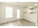 Eat-in kitchen/dining area features luxury vinyl plank flooring and natural light at 1628 Sandpiper Dr, Rock Hill, SC 29732