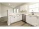 Bright kitchen featuring white cabinets, stainless steel appliances, and luxury vinyl plank flooring at 1628 Sandpiper Dr, Rock Hill, SC 29732