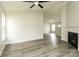 Bright living room with luxury vinyl plank flooring, fireplace, and ample natural light at 1628 Sandpiper Dr, Rock Hill, SC 29732