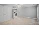 Bedroom with neutral gray walls, carpet flooring, and an ensuite office space in the background at 1677 Shetland Ln, Rock Hill, SC 29730