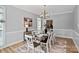 Elegant dining room with stylish decor, modern lighting, and seating for eight at 1677 Shetland Ln, Rock Hill, SC 29730