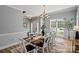 Elegant dining room with stylish decor, modern lighting, and seating for eight at 1677 Shetland Ln, Rock Hill, SC 29730