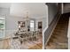 Elegant dining room with stylish decor, modern lighting, and seating for eight at 1677 Shetland Ln, Rock Hill, SC 29730