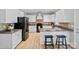 Well-lit kitchen with an island, stainless steel appliances, granite countertops, and breakfast bar at 1677 Shetland Ln, Rock Hill, SC 29730