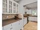 Charming kitchen featuring granite countertops, white cabinets, and modern appliances at 1677 Shetland Ln, Rock Hill, SC 29730