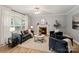 Inviting living room with comfortable seating, a fireplace, and a large window at 1677 Shetland Ln, Rock Hill, SC 29730