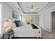 Comfortable main bedroom with a tray ceiling, carpet flooring, and large window at 1677 Shetland Ln, Rock Hill, SC 29730