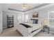 Elegant main bedroom suite with tray ceiling, carpet flooring, and ensuite bathroom at 1677 Shetland Ln, Rock Hill, SC 29730