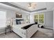 Elegant main bedroom suite with tray ceiling, carpet flooring, and large window at 1677 Shetland Ln, Rock Hill, SC 29730