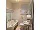 Cozy bathroom featuring a vintage clawfoot tub, classic fixtures, and a bright vanity at 180 Tower Rd, Troy, NC 27371