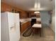 Functional kitchen with wooden cabinets and essential appliances for meal preparation at 180 Tower Rd, Troy, NC 27371