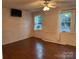 Spacious living room with hardwood floors and ample natural light, ideal for relaxation and entertainment at 180 Tower Rd, Troy, NC 27371