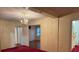 Charming living room with vintage chandelier and classic architectural details at 180 Tower Rd, Troy, NC 27371