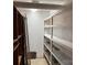 Organized storage room featuring multiple shelves and ample storage space at 180 Tower Rd, Troy, NC 27371