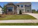 Beautiful two-story home featuring stone accents, gray siding, manicured lawn, and a spacious driveway at 2084 Fordhill St, Rock Hill, SC 29732