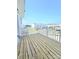 Outdoor balcony with wood flooring and white railing overlooking a residential neighborhood at 2137 Barrowcliffe Dr # 49, Concord, NC 28027