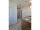Bathroom with double sink vanity, granite countertop, and glass-enclosed tiled shower at 2137 Barrowcliffe Dr # 49, Concord, NC 28027