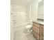 Bathroom featuring a tub shower combo, vanity with light wood cabinets, and gray tile floor at 2137 Barrowcliffe Dr # 49, Concord, NC 28027