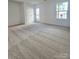 Neutral bedroom with a private exterior access door, large window and plush carpet at 2137 Barrowcliffe Dr # 49, Concord, NC 28027
