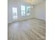 Dining room area with access to a private balcony, hardwood floors, and natural light at 2137 Barrowcliffe Dr # 49, Concord, NC 28027