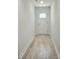 Bright entryway with wood-look flooring and a white front door with glass inserts at 2137 Barrowcliffe Dr # 49, Concord, NC 28027