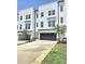 New construction townhome featuring a large driveway, garage, modern siding, and a manicured lawn at 2137 Barrowcliffe Dr # 49, Concord, NC 28027