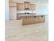 Spacious kitchen with an island, wood cabinets, granite countertops, and modern appliances at 2137 Barrowcliffe Dr # 49, Concord, NC 28027