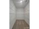 Walk-in closet with carpet flooring and wire shelving installed at 2137 Barrowcliffe Dr # 49, Concord, NC 28027