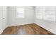 Bright bedroom features wood-look flooring, white walls, and ample natural light from the window at 2488 Catawba Church Rd, Rock Hill, SC 29730