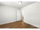 Bright bedroom features white walls and wood-look flooring and a doorway leading to another room at 2488 Catawba Church Rd, Rock Hill, SC 29730