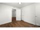 Bright bedroom has white walls, and a doorway leading to another room, complemented by wood-look flooring at 2488 Catawba Church Rd, Rock Hill, SC 29730
