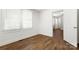 Bright bedroom boasts wood-look flooring, white walls, and a doorway leading to another room at 2488 Catawba Church Rd, Rock Hill, SC 29730