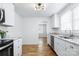 Bright kitchen with white cabinets, granite countertops, stainless appliances, and wood grain floors at 2488 Catawba Church Rd, Rock Hill, SC 29730