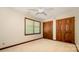 A bright bedroom with double closets, neutral carpet, and natural light from the window at 2615 Highway 557 None, Clover, SC 29710