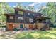 The back exterior of the home features a large brick foundation, deck, and yard space at 2615 Highway 557 None, Clover, SC 29710