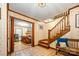 Welcoming foyer with hardwood staircase and a glimpse of the living room at 2615 Highway 557 None, Clover, SC 29710