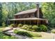 Beautiful two-story home with a welcoming front porch and lush landscaping at 2615 Highway 557 None, Clover, SC 29710
