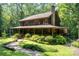 Two-story home with charming front porch and beautifully maintained landscaping at 2615 Highway 557 None, Clover, SC 29710
