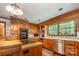 Warm kitchen featuring wood cabinets, stainless steel appliances, and a large window, plus a butcher block island at 2615 Highway 557 None, Clover, SC 29710