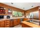 Bright kitchen with wood cabinets, stainless steel appliances, and a large window over the sink, plus an island at 2615 Highway 557 None, Clover, SC 29710