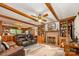 Cozy living room with a brick fireplace, built-in bookshelves, and wood beam ceilings at 2615 Highway 557 None, Clover, SC 29710