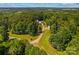 Secluded homesite with lush green canopy, long driveway, and mature trees at 265 River Run Rd, Statesville, NC 28625